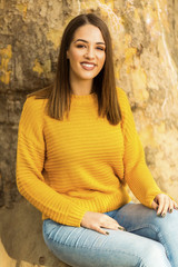 Pretty and happy young woman outdoors