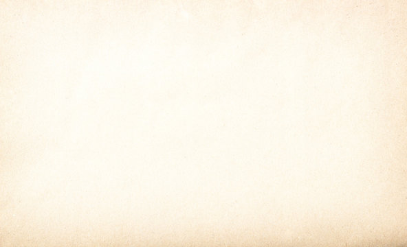 Old vintage paper with a glowing center and grunge vignette.