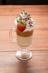 Cold coffee drink frappe (frappuccino), with whipped cream and chocolate nibs, with grains of...