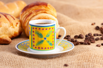 Breakfast with Italian bread, cheese bread, chocolate donut, coffee and croissant