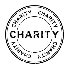 Grunge black charity word round rubber seal stamp on white background
