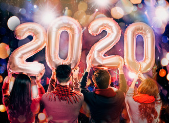 happy young group celebrating new year 2020 party