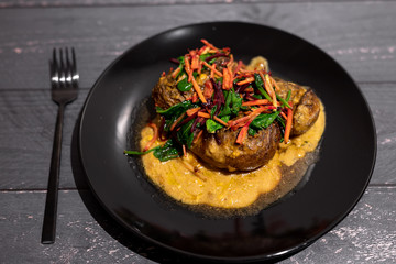 baked potatoes with curry sauce and mixed veggies on top