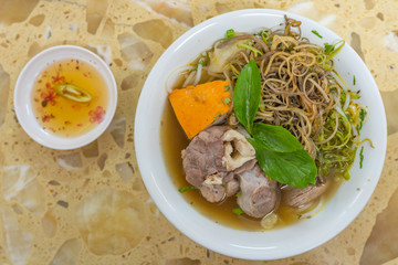 Delicious Vietnamese beef noodles soup and fresh vegetables