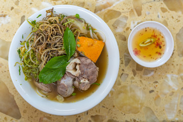 Traditional beef marrow bones noodle soup and vegetables