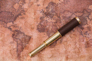 top view of telescope on ancient world map