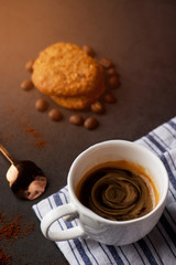 cup of coffee on black background with copy space for text