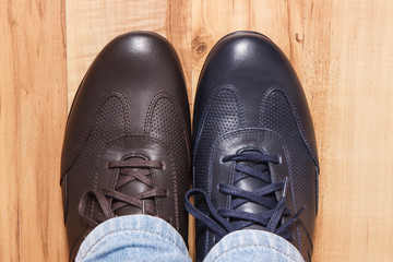 Elegant stylish navy blue and brown shoes for men on board