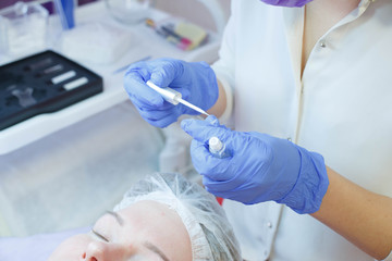 Woman on the procedure for eyelash extensions, eyelashes lamination