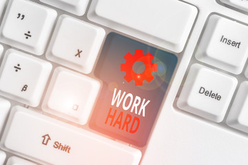 Word writing text Work Hard. Business photo showcasing Laboring that puts effort into doing and...