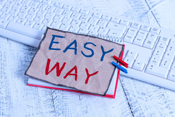 Text sign showing Easy Way. Business photo text making hard decision between two less and more effort method notebook paper reminder clothespin pinned sheet white keyboard light wooden