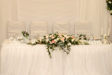 Beautiful flowers on table in wedding day. Rustic style wedding table decoration and setting