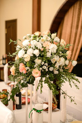 Beautiful flowers on table in wedding day. Rustic style wedding table decoration and setting