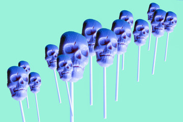 human skull lollipops pattern in neon colors ,trendy art halloween background