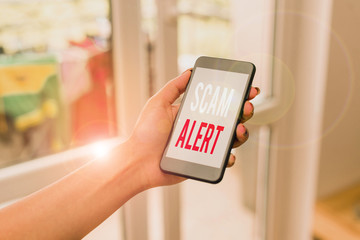 Handwriting text writing Scam Alert. Conceptual photo warning someone about scheme or fraud notice...