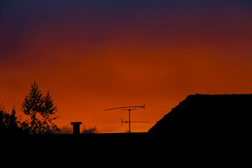 SILHOUETTE: Evening sky creates a contrast with a black silhouette of a roof