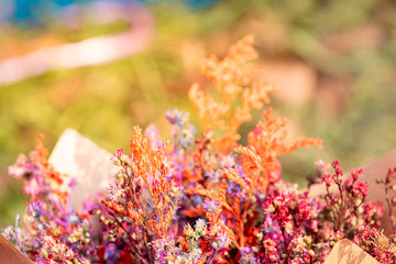 Selective focus, bunches of beautiful flowers bouquet in the market, bright mixed colorful flowers bouquet in vintage paper in florist shop