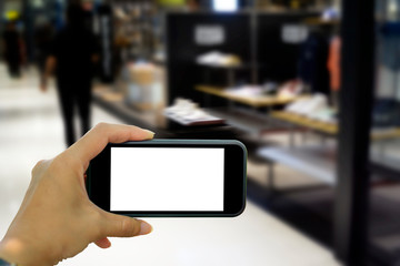 hand holding smart phone with blank screen