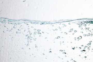 Closeup bubbles underwater on white background.