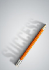 Business success creative concept, pencil with success shadow