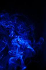 Blue smoke motion on black background.