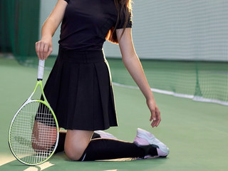 Girl on the tennis court playing in Tennessee.