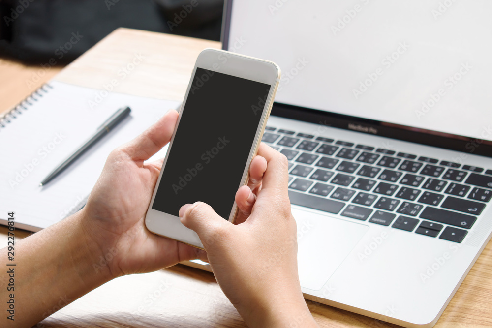 Poster close-up image of the smartphone screen is black on the working desk with copy space.