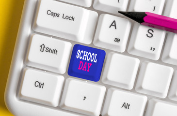 Text sign showing School Day. Business photo text starts from seven or eight am to three pm get taught there White pc keyboard with empty note paper above white background key copy space