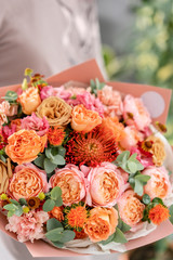 Bouquet Peach and orange color. beautiful hydrangea flowers in a vase on a table . Decoration of home. Wallpaper and background.