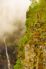 Tourist woman by Voringsfossen waterfall, Norway