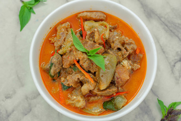 Beef in red curry with coconut milk and holy basil