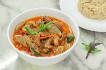 Beef in red curry with coconut milk and holy basil