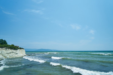 Fototapeta na wymiar Image of the sea shore. The wave breaks on the stones.