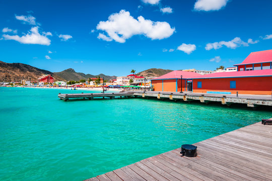 Philipsburg, St Maarten (Sint Maarten, Saint Martin), Caribbean. Wooden dock and colorful buildings at Great Bay beach. Popular cruise destination.