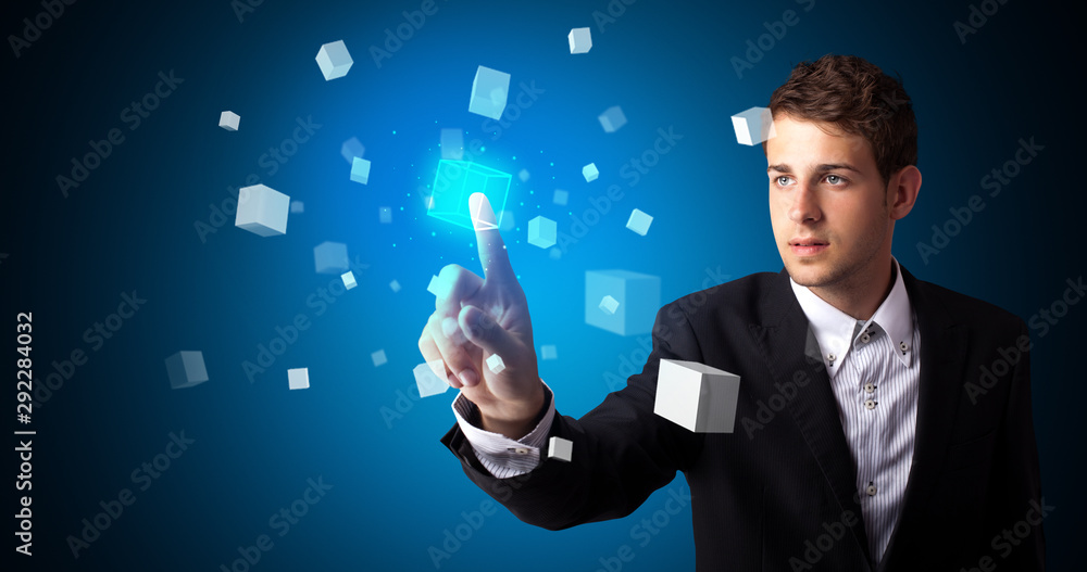 Aufkleber Man touching hologram screen displaying cube symbols