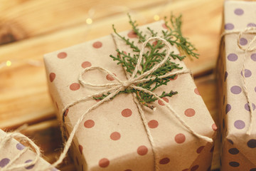 Small christmas gifts on wooden background, view from above
