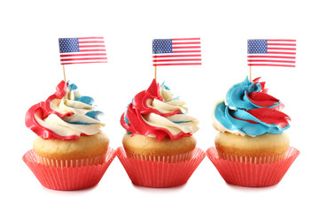 Tasty patriotic cupcakes on white background