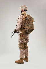 Rear view of military soldier US army marines operator studio shot portrait