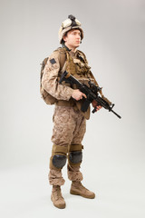 United states Marine Corps special operations command  raider with weapon. Studio shot
