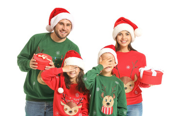 Happy family with Christmas gifts on white background