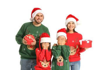 Happy family with Christmas gifts on white background