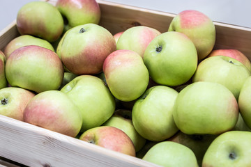 fresh fruit apples in a wooden box. Harvest of ripe apples