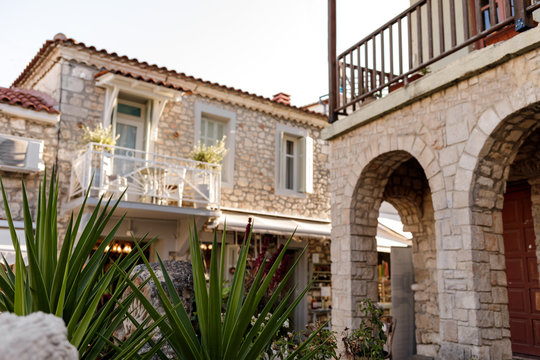 The beautiful ancient city of Afitos in Greece. green leaves in the foreground