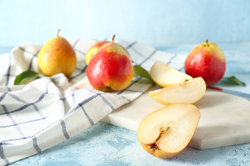 Tasty fresh pears on color background