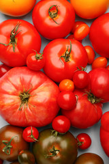 Different fresh tomatoes as background