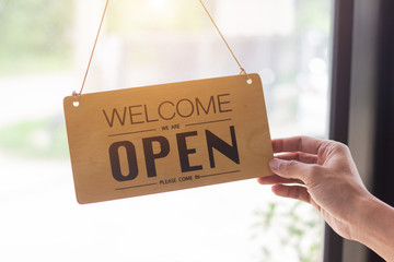 Close up sign hanging open Coffee shop door,Open sign blur background,Label word open