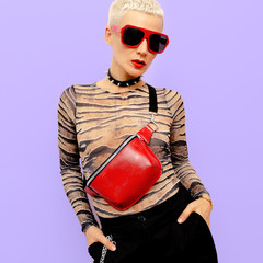 Fashion Model Swag Luxury style. Stylish accessories. Clutch and sunglasses Blonde Short hair