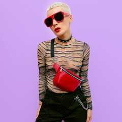 Fashion Blonde Lady Tomboy Luxury style. Stylish accessories. Clutch and sunglasses