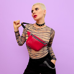 Fashion Swag Luxury Model. Stylish accessories. Clutch and choker. Nice short hair