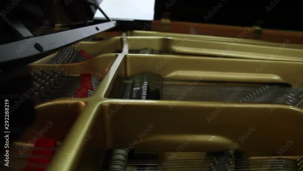 Poster closeup view of the inner working of a piano while playing